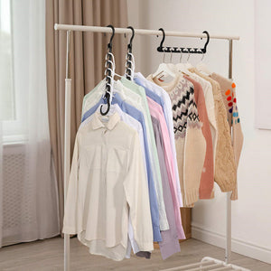 10-Pack 360° Rotating Magic Cascading Hangers in black, holding pastel shirts and patterned knitwear on a clothes rail