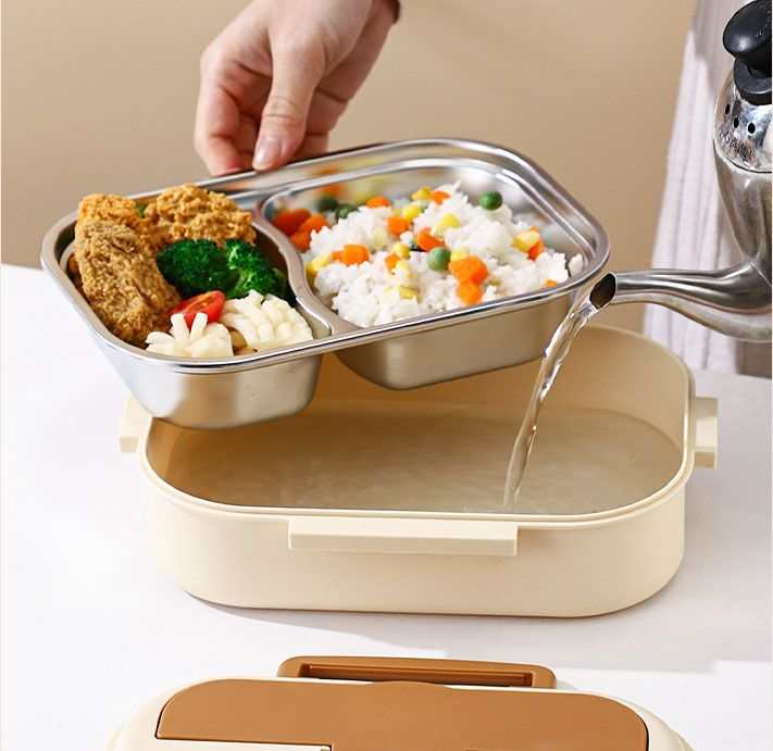 2 Grids 316 Stainless Steel lunch box with a divided metal tray holding rice, vegetables and breaded food