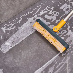 2 in 1 Floor Brush with white silicone bristles, dark teal head and yellow angled connector on a metal handle