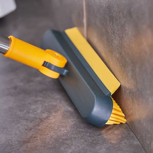 2 in 1 Floor Brush with a yellow scraper edge and yellow bristles on a dark grey angled head