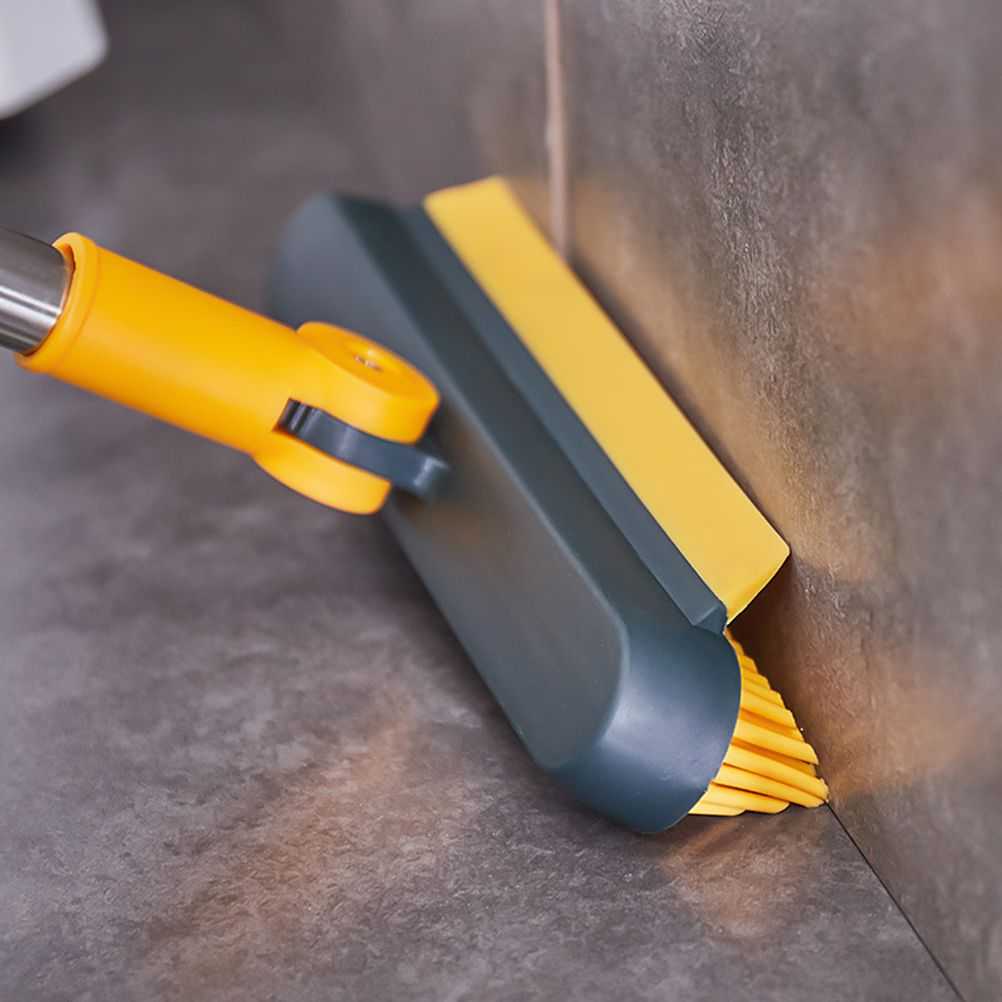 2 in 1 Floor Brush with a yellow scraper edge and yellow bristles on a dark grey angled head