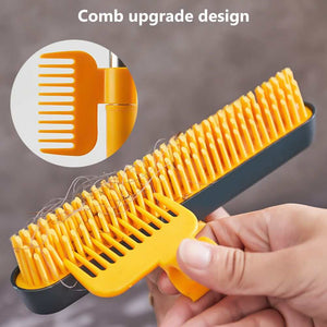 2 in 1 Floor Brush with bright yellow-orange silicone comb bristles and a dark scraper edge for lifting hair