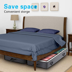 2 Pack Folding Non-Woven under-bed storage containers in dark grey fabric with reinforced handles, tucked beneath a bed
