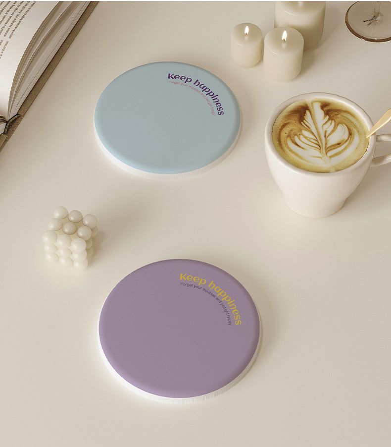2 Pcs Blue Quick-Dry round drink coasters shown in pale blue and lavender, with smooth surfaces and printed text
