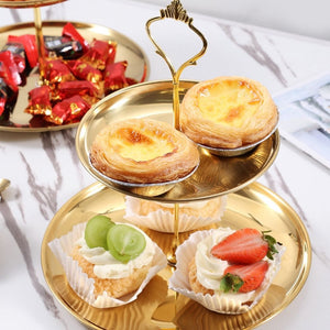 2 Tier Cupcake Stand Holder in gold metal, featuring round raised-edge trays, a decorative central post and pastries
