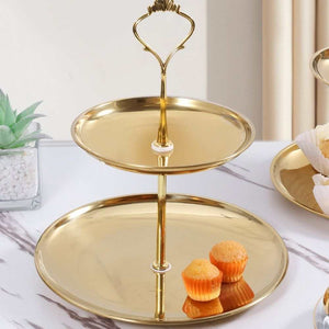 2 Tier Cupcake Stand Holder in polished gold-tone metal with two round trays, a central stem and decorative loop handle