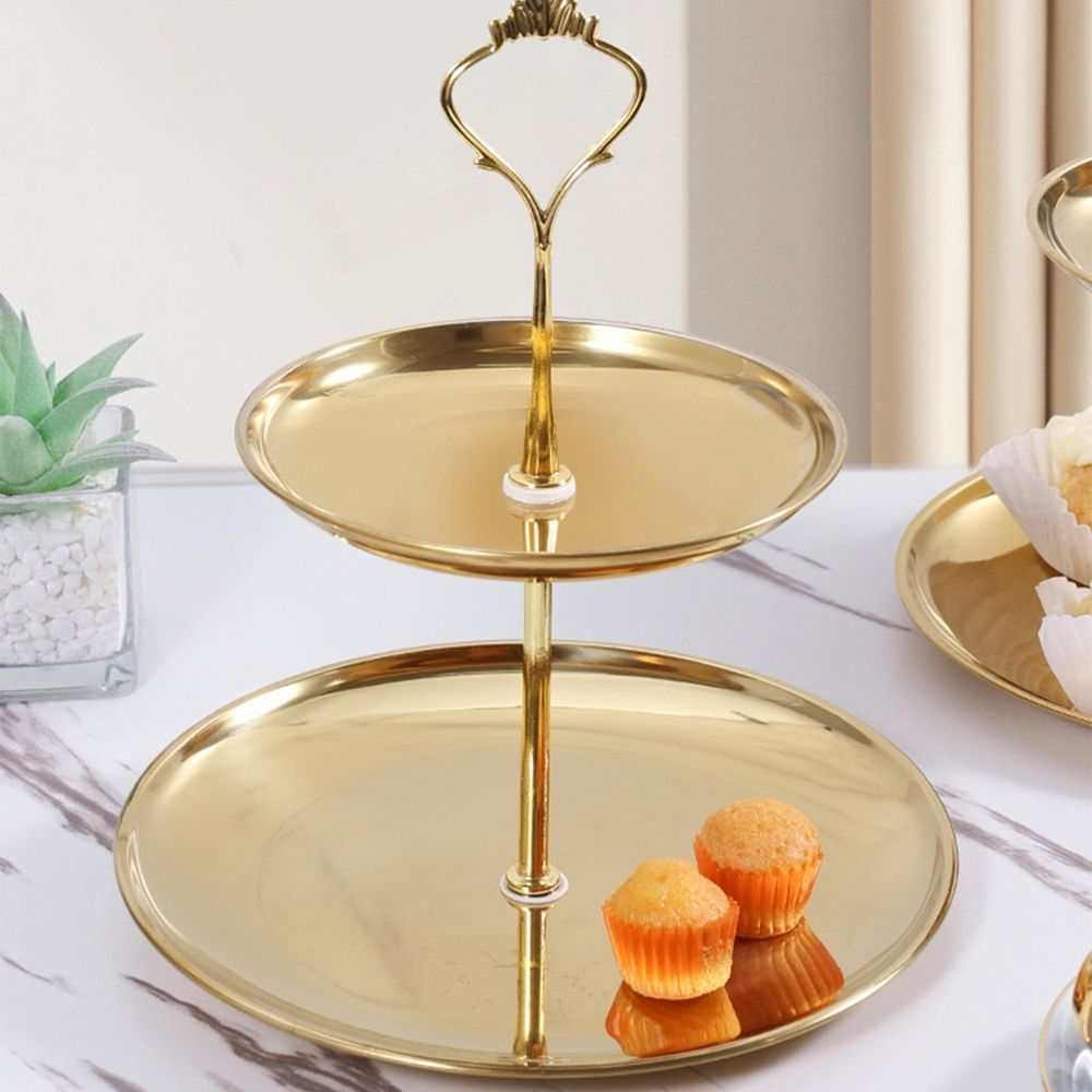 2 Tier Cupcake Stand Holder in polished gold-tone metal with two round trays, a central stem and decorative loop handle