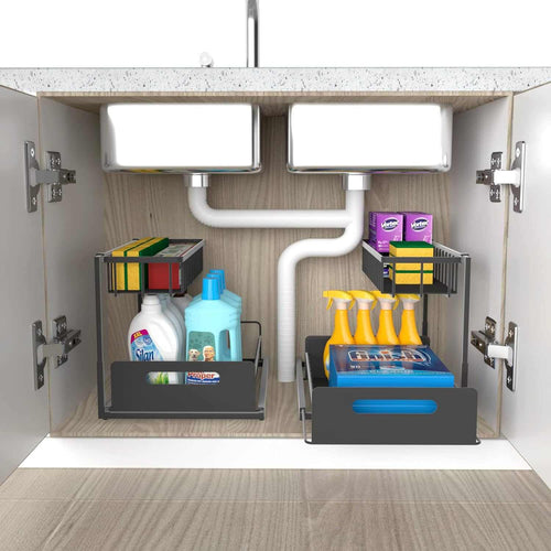 2-Tier Under-Sink Organiser in black metal with sliding baskets, arranged around plumbing pipes and holding cleaning supplies