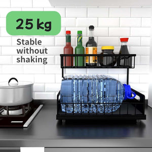 2-Tier Under-Sink Organiser in black metal with two open sliding baskets, holding bottles and a large water container