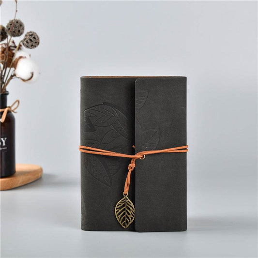 2PCS Black Vintage A5 journals in black embossed leather with leaf patterns, orange tie cords and metal leaf charm