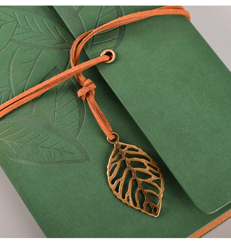 2PCS Black Vintage A5 leather journals shown in green, with embossed leaf covers, orange tie cords and bronze leaf charm