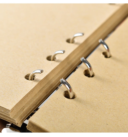 2PCS Black Vintage A5 journal pages with blank tan paper and shiny silver ring binding, shown in close detail