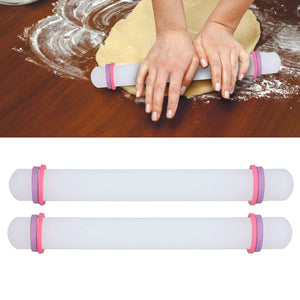 2Pcs Plastic Rolling Pin set in white with pink ring accents, smooth cylindrical barrels and rounded ends.