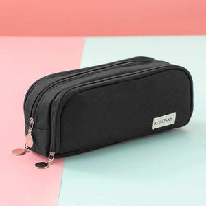 3 Compartment Pencil Case in black textured fabric with three zippered sections and a small logo patch