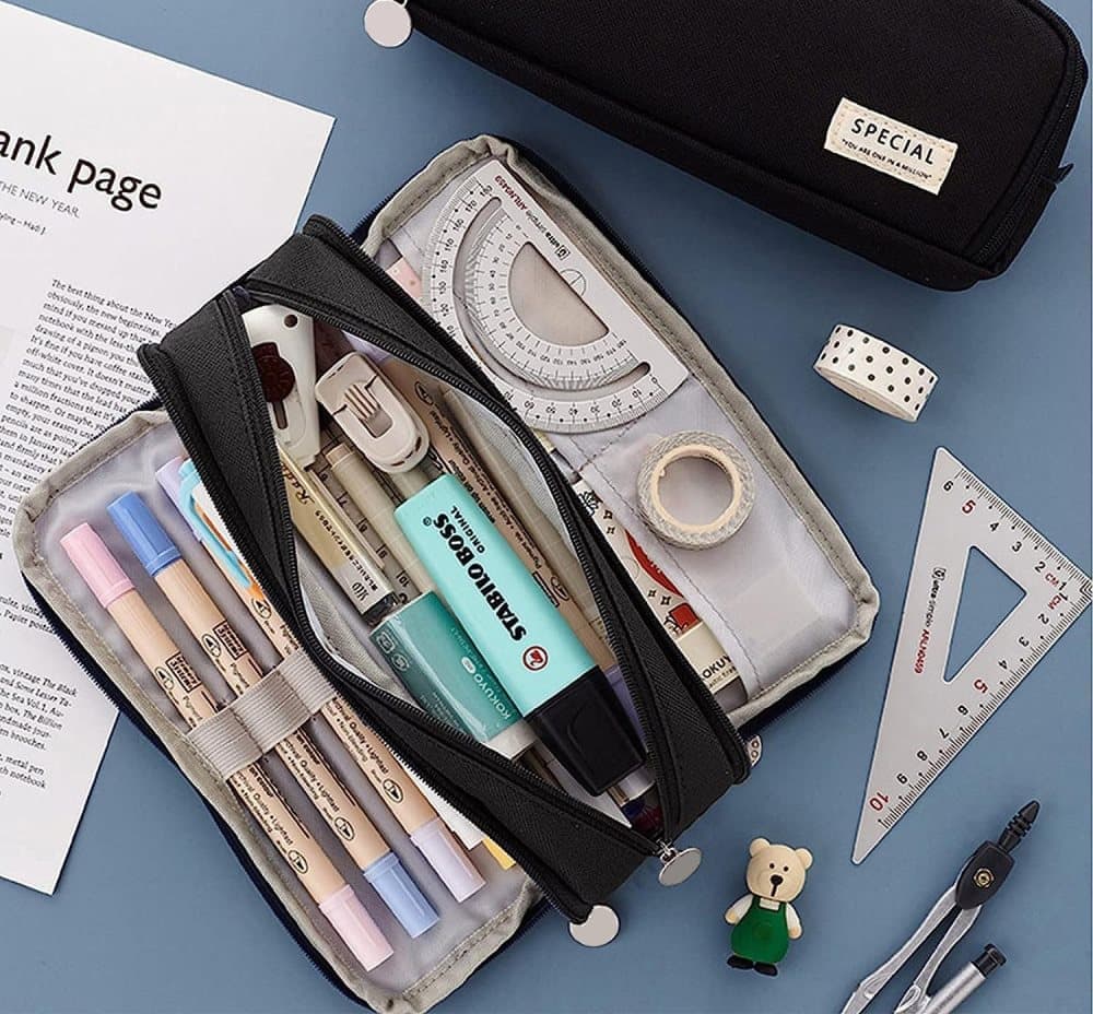 3 Compartment Pencil Case in black fabric with three zip sections, elastic pen loops and stationery neatly arranged inside
