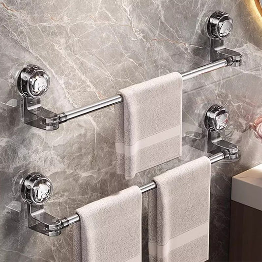 30–60 cm extendable towel rail with a silver metal bar and clear suction-cup mounts, holding beige towels