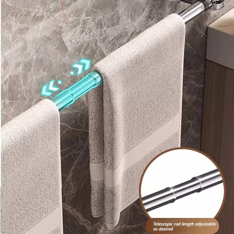 30–60 cm extendable towel rail with a polished silver telescopic rod holding two pale beige towels