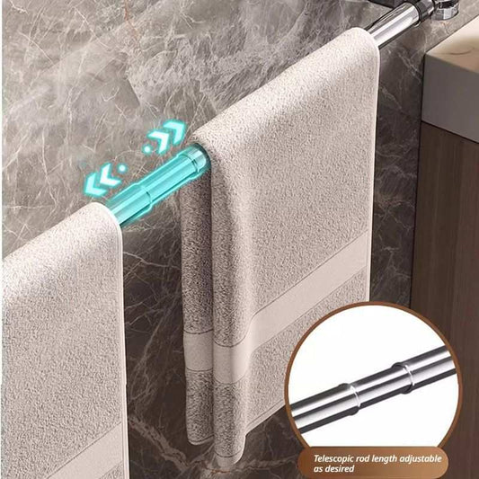 30–60 cm extendable towel rail with a polished silver telescopic rod holding two pale beige towels