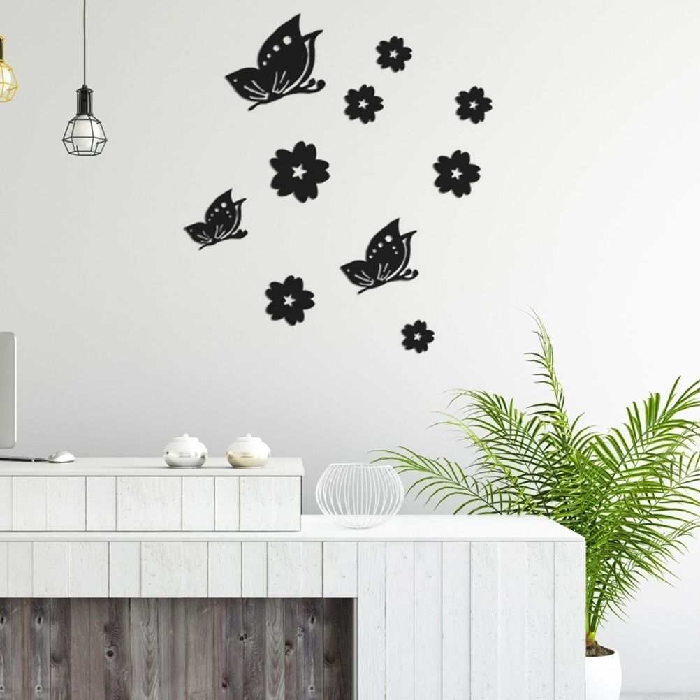 3D Mirror Wall Sticker set with black butterfly and flower shapes in a scattered decorative wall arrangement