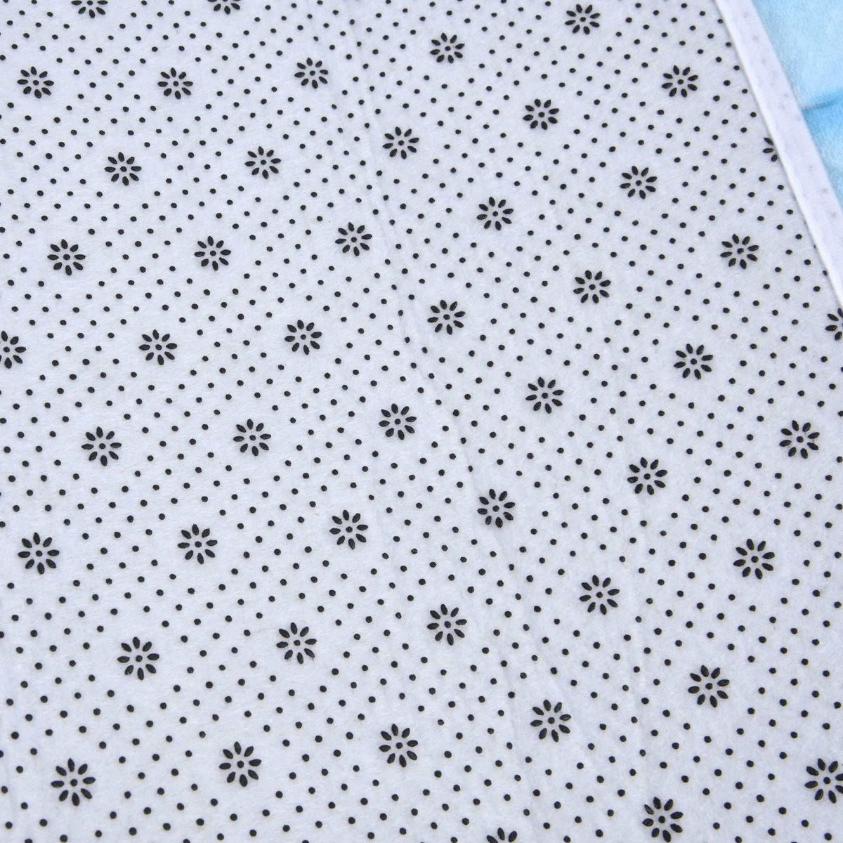 3D Pattern Doormat in white flannel with a repeating black floral and dotted pattern and a stitched edge