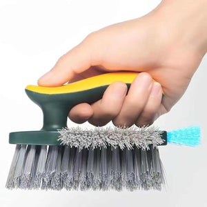 4-in-1 Grout Brush with dark green handle, yellow grip, dense gray bristles and a turquoise squeegee edge