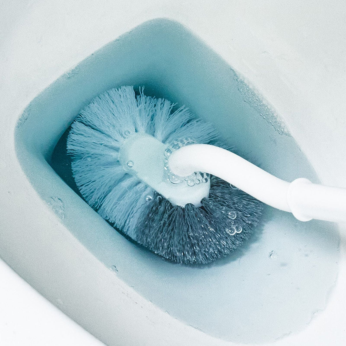 4 Pieces Toilet Bowl Brush Set with a white plastic handle and dense blue-and-white bristles cleaning inside a toilet bowl