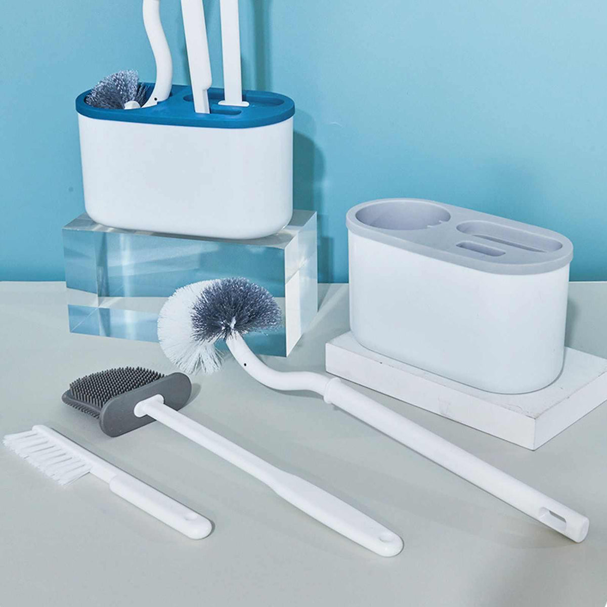 4 Pieces Toilet Bowl Brush Set in white plastic, with a wall-mounted holder and three distinct brush heads for cleaning