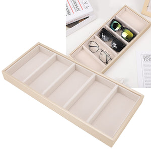 5 grid glasses case in beige leather with five padded compartments, shown holding eyeglasses and sunglasses
