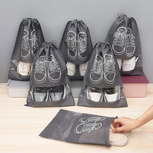 50-Pack Shoe Storage Bags in charcoal gray non-woven fabric with clear windows, drawstrings and white shoe outlines