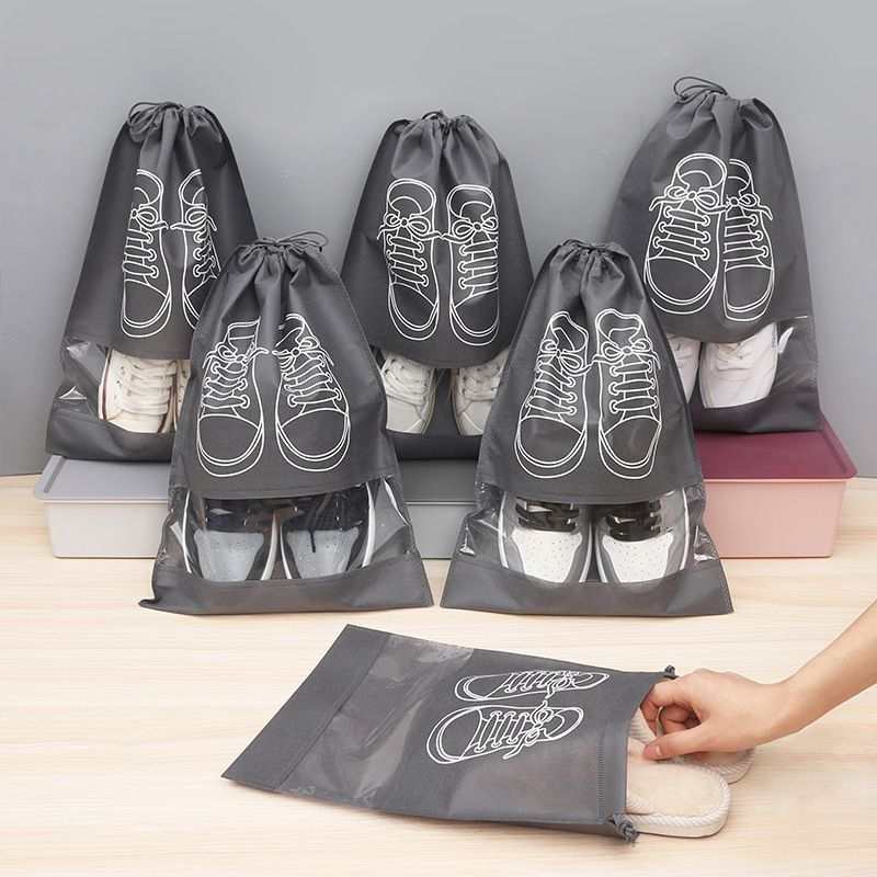 50-Pack Shoe Storage Bags in charcoal gray non-woven fabric with clear windows, drawstrings and white shoe outlines