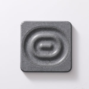 Square dark grey diatomite coaster with a textured stone surface and raised circular centre, 6-Pack Dark Grey Instant Dry