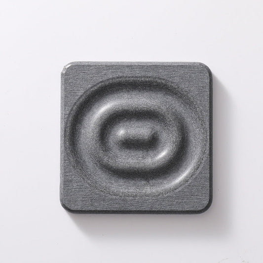 Square dark grey diatomite coaster with a textured stone surface and raised circular centre, 6-Pack Dark Grey Instant Dry