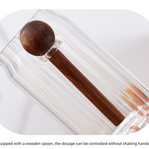 600ml Premium Borosilicate Glass storage jar with a clear cylindrical body and dark brown wooden spoon inside