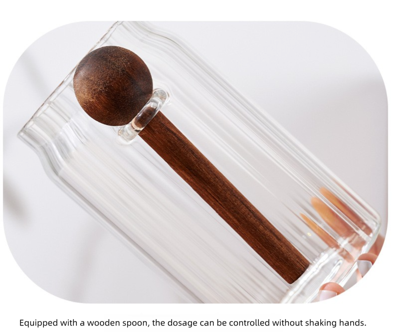 600ml Premium Borosilicate Glass storage jar with a clear cylindrical body and dark brown wooden spoon inside