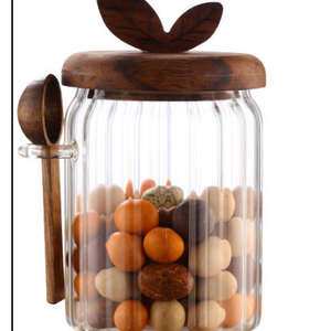 600ml Premium Borosilicate Glass storage jar with a clear ribbed cylindrical body, dark wooden butterfly lid and side spoon