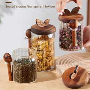600ml Premium Borosilicate Glass storage jars with clear cylindrical bodies, dark wood lids, and matching wooden spoons