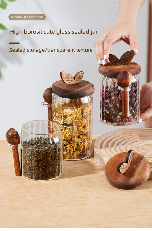 600ml Premium Borosilicate Glass storage jars with clear cylindrical bodies, dark wood lids, and matching wooden spoons