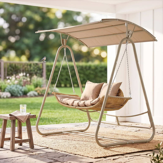 Gardeon Outdoor Swing Chair with beige woven rattan two-seat bench, soft cushions, and a wide fabric canopy