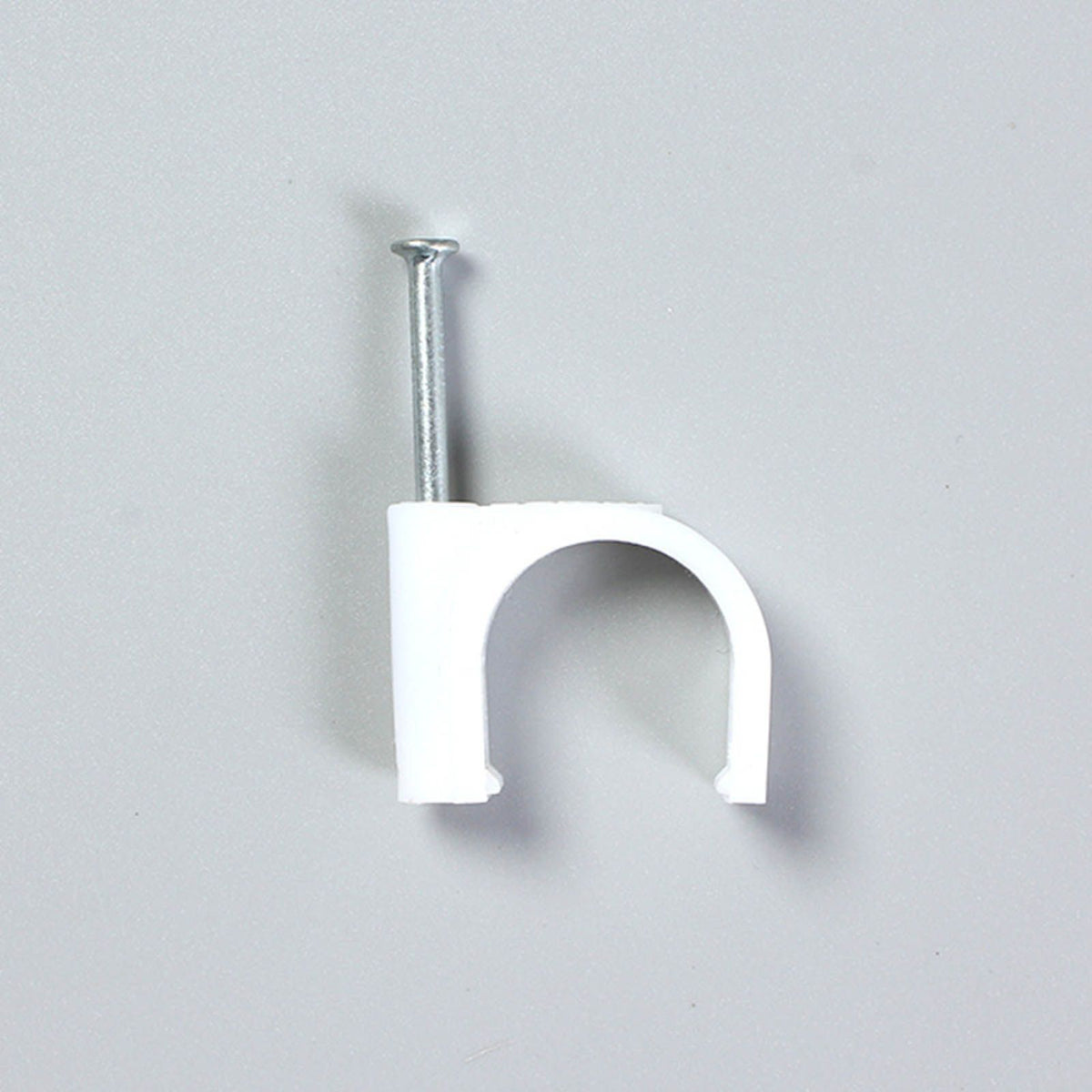Steel Nail Cable Fixing Clips in white plastic with a silver metal nail and arched snap-in cable holder