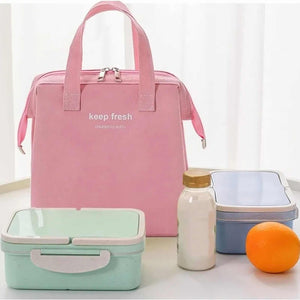 Insulated Lunch Bag in pink fabric with dual handles, a two-way zipper and front pocket, shown with lunch containers