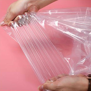 Hanging Garment Bag in clear semi-transparent PE plastic, shown stretched open with a smooth, flexible surface.