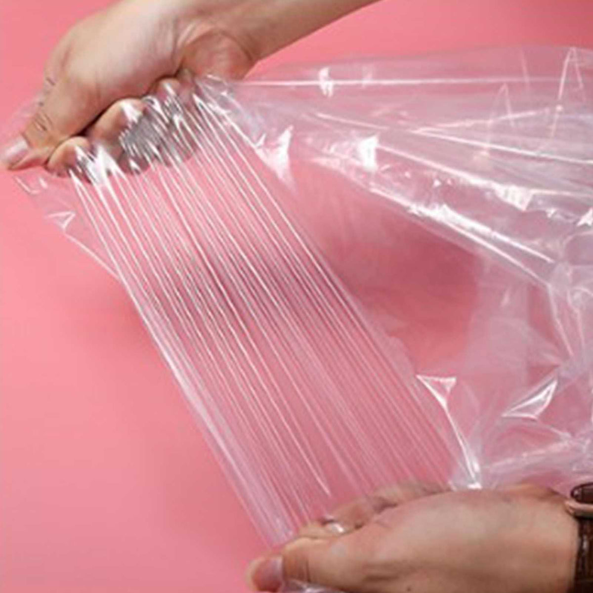 Hanging Garment Bag in clear semi-transparent PE plastic, shown stretched open with a smooth, flexible surface.