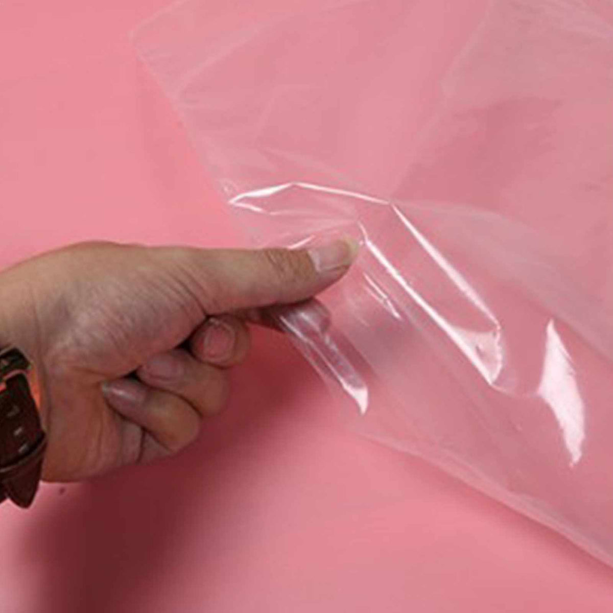 Hanging Garment Bag made from thin, clear semi-transparent PE plastic, shown as a lightweight flexible sheet