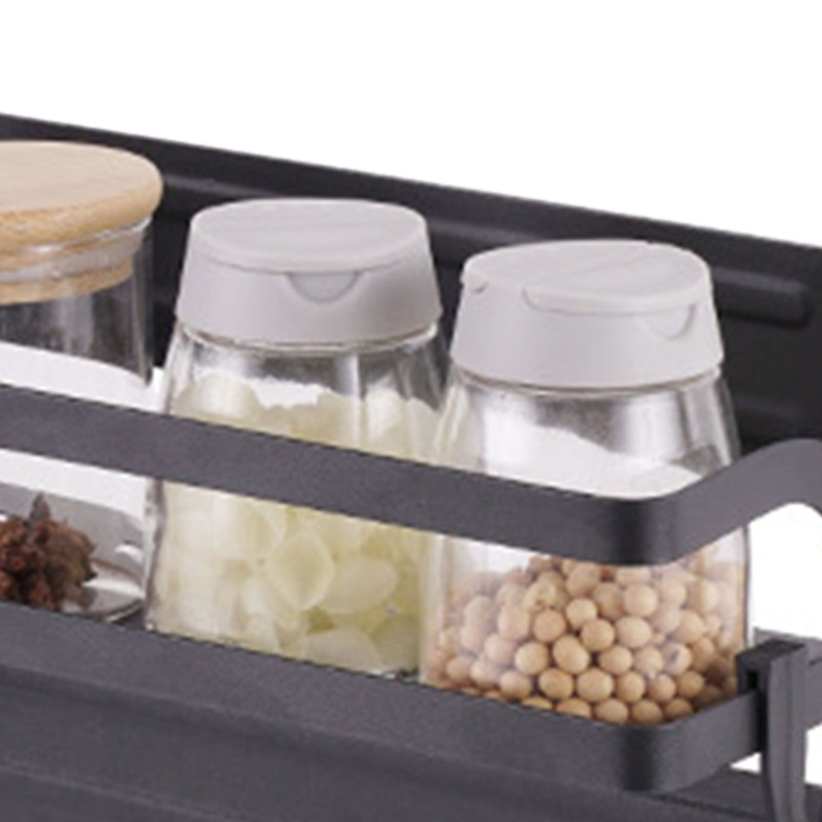 Refrigerator Magnetic Storage Shelf in dark metal with a single raised rail, holding clear jars of spices and seasonings