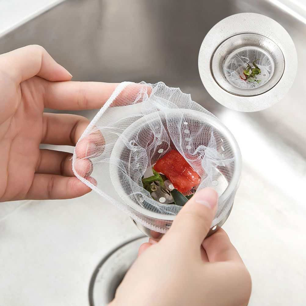 200 Pcs Sink Strainer Bag, fine white polyester mesh stretched over a metal strainer holding food scraps