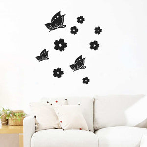 3D Mirror Wall Sticker set of black butterflies and flowers, featuring decorative silhouettes above a white sofa