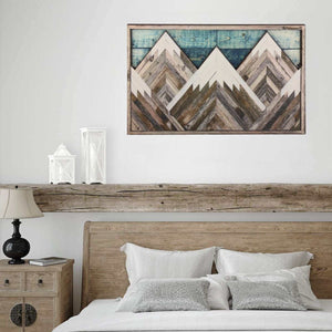 Mountain Wood Wall Art with layered geometric peaks in weathered white, brown and grey wood against a blue plank sky