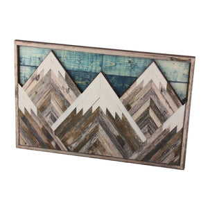 Mountain Wood Wall Art featuring layered geometric peaks in weathered brown and cream wood, with a blue plank backdrop and rustic frame
