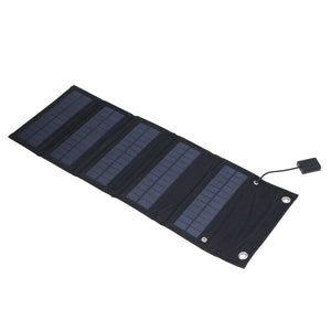 9W Solar Panel with four dark monocrystalline solar cell sections in a black foldable fabric charger with USB cable