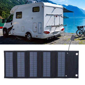 9W Solar Panel foldable charger with dark fabric backing, multiple blue-black solar cell sections and metal grommets